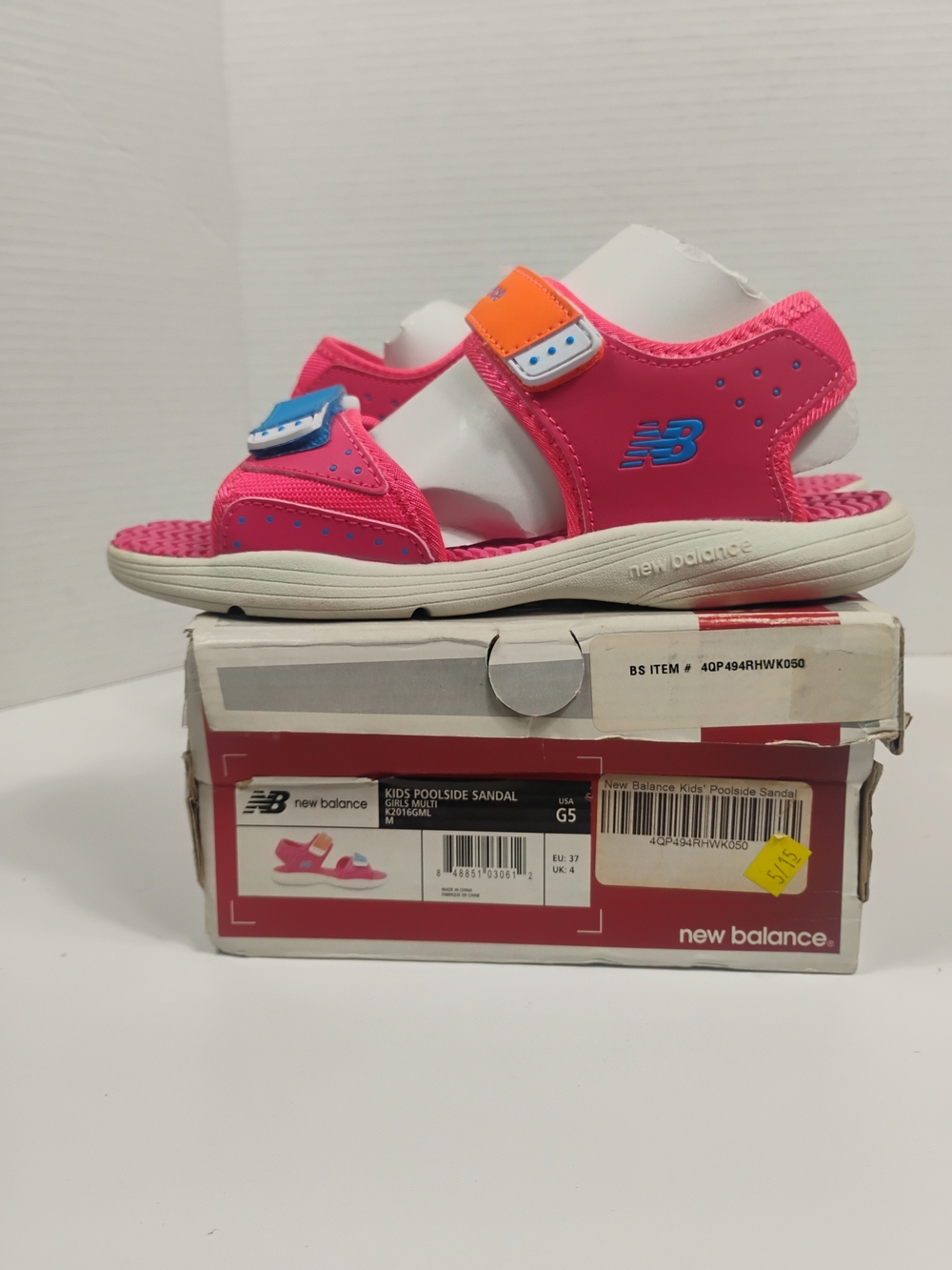 New Balance Kids Hot Pink Sandals with Blue and Orange Tabs